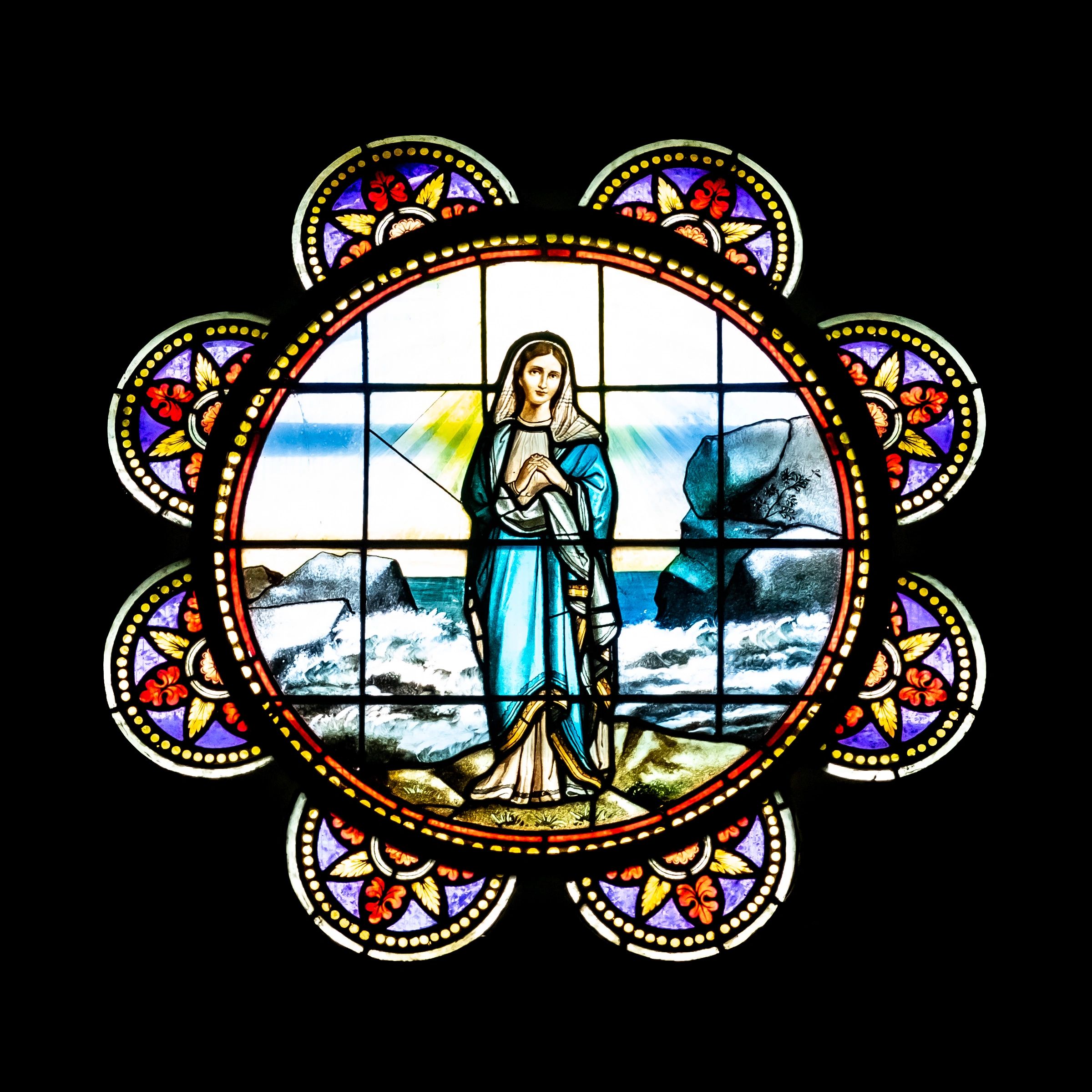 Stained glass window featuring the Virgin Mary