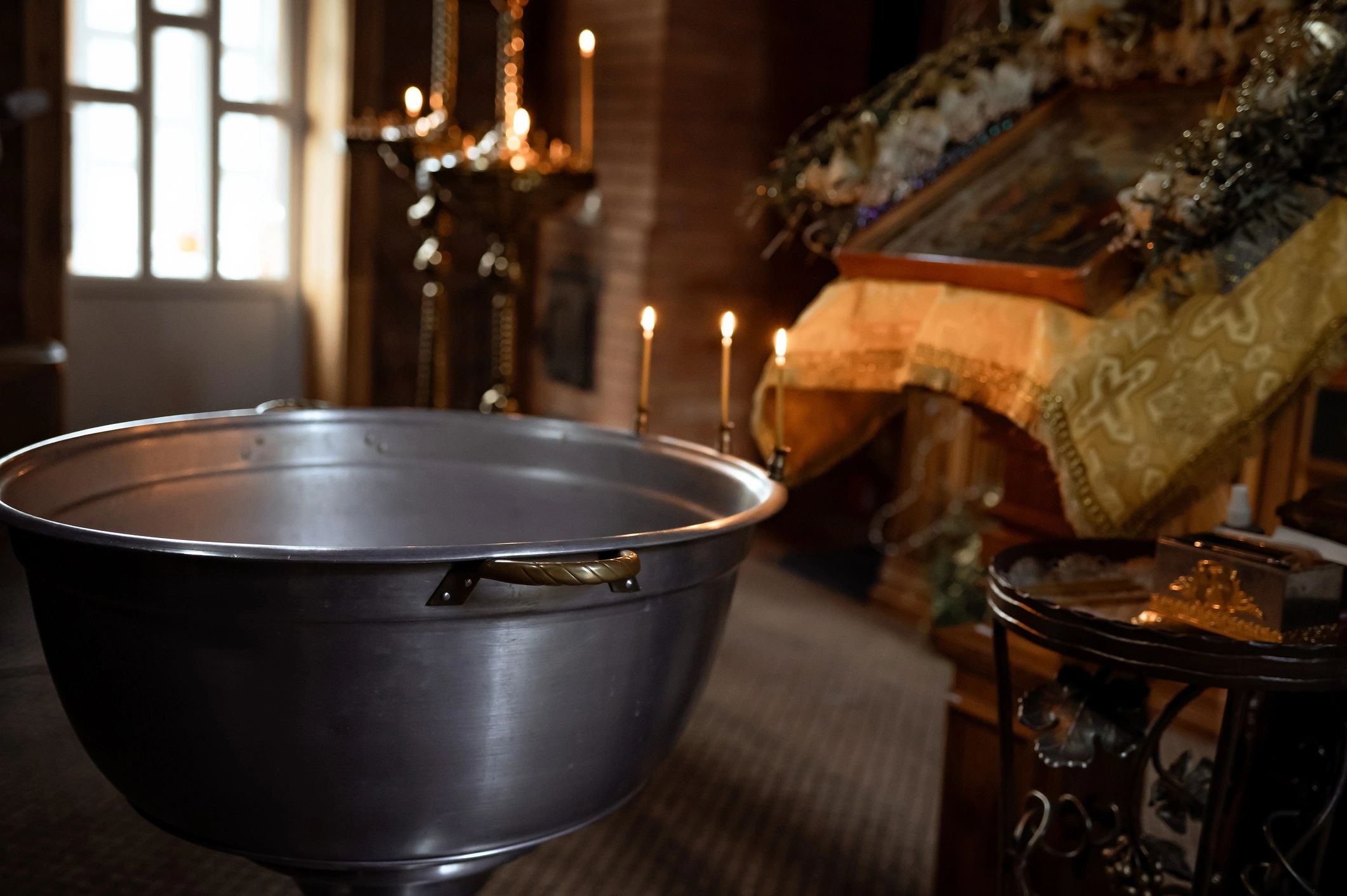 Traditional baptismal font in a church interior